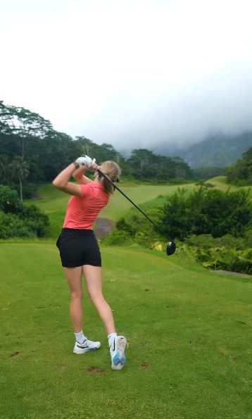 Grace Charis playing golf